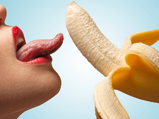 Girl licking banana