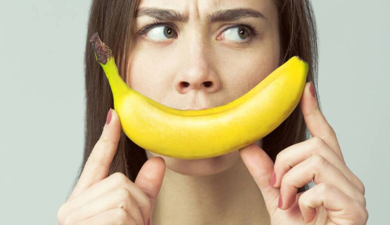 Banana girl imitates penis enlargement massage